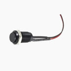 Black button switch with red wire on a white background