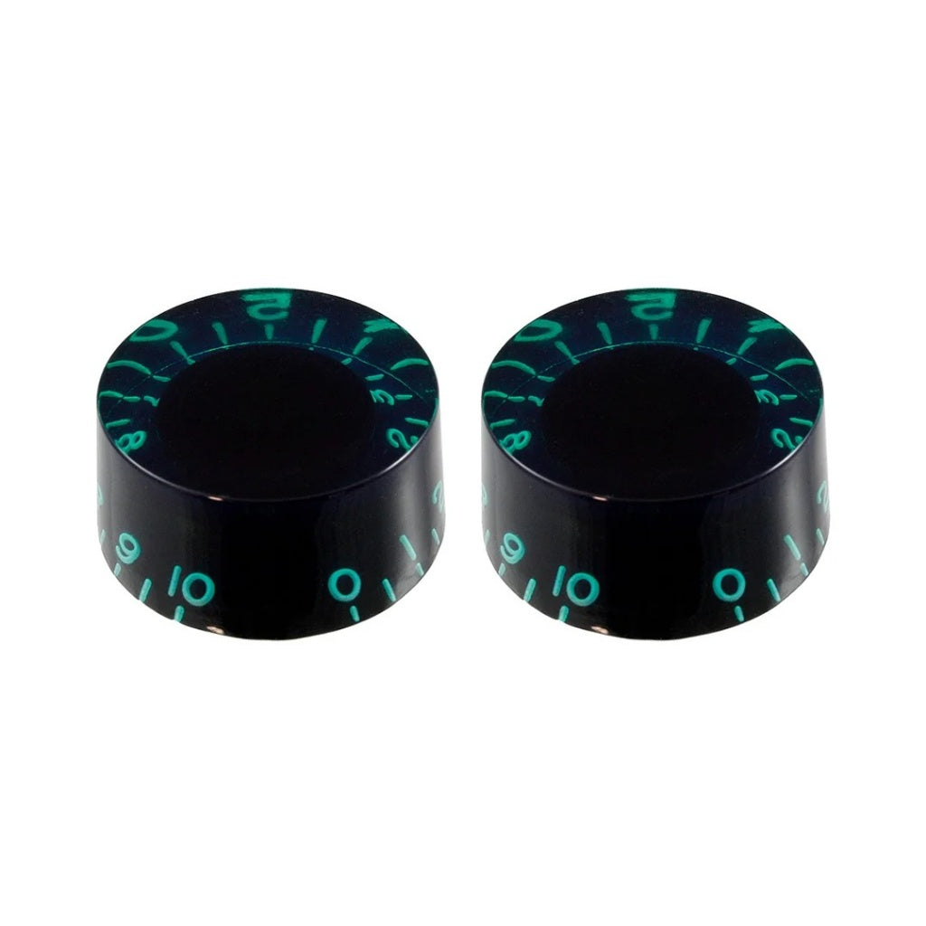 Two black knobs with green markings on a white background