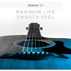 Acoustic guitar with D'Addario XS branding on a white background