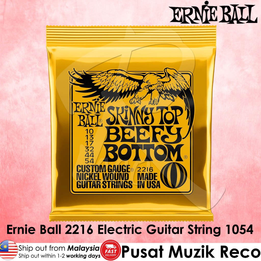 Ernie Ball Skinny Top Beefy Bottom electric guitar string package in a bright yellow pouch with black text and eagle graphic, shown on a pink background with product text overlays.