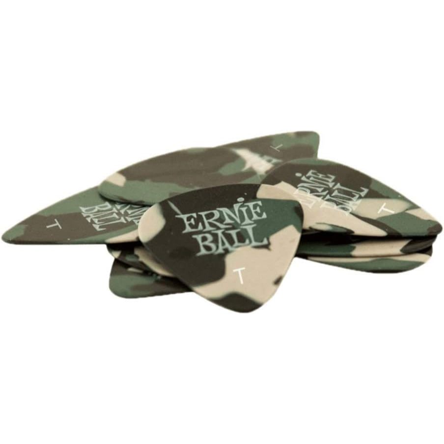 A stack of guitar picks featuring a green and beige camouflage pattern with 'ERNE BALL' printed in white on the front pick.