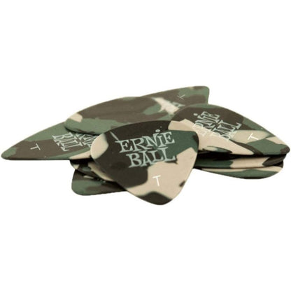 A stack of guitar picks featuring a green and beige camouflage pattern with 'ERNE BALL' printed in white on the front pick.