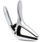 A polished silver metal spring clamp with black rubber pads inside the jaws, shown on a clean white background.
