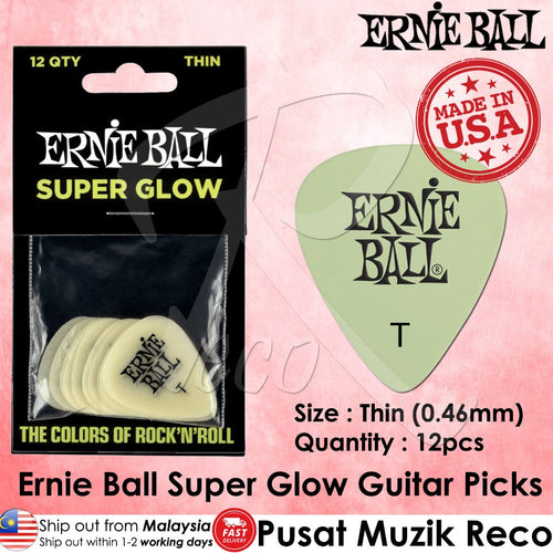 Ernie Ball Super Glow Thin guitar picks in a 12-pack, shown in their black retail packaging alongside a single pale green pick displaying the Ernie Ball logo. The image includes a 'Made in USA' stamp and product specifications.
