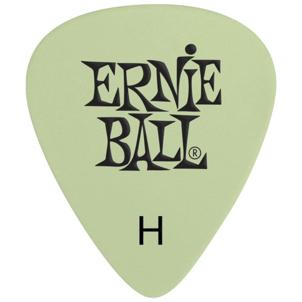 A single Ernie Ball H-shaped guitar pick in a light sage green color with black printed brand lettering and an 'H' size indicator, shown on a plain white background.