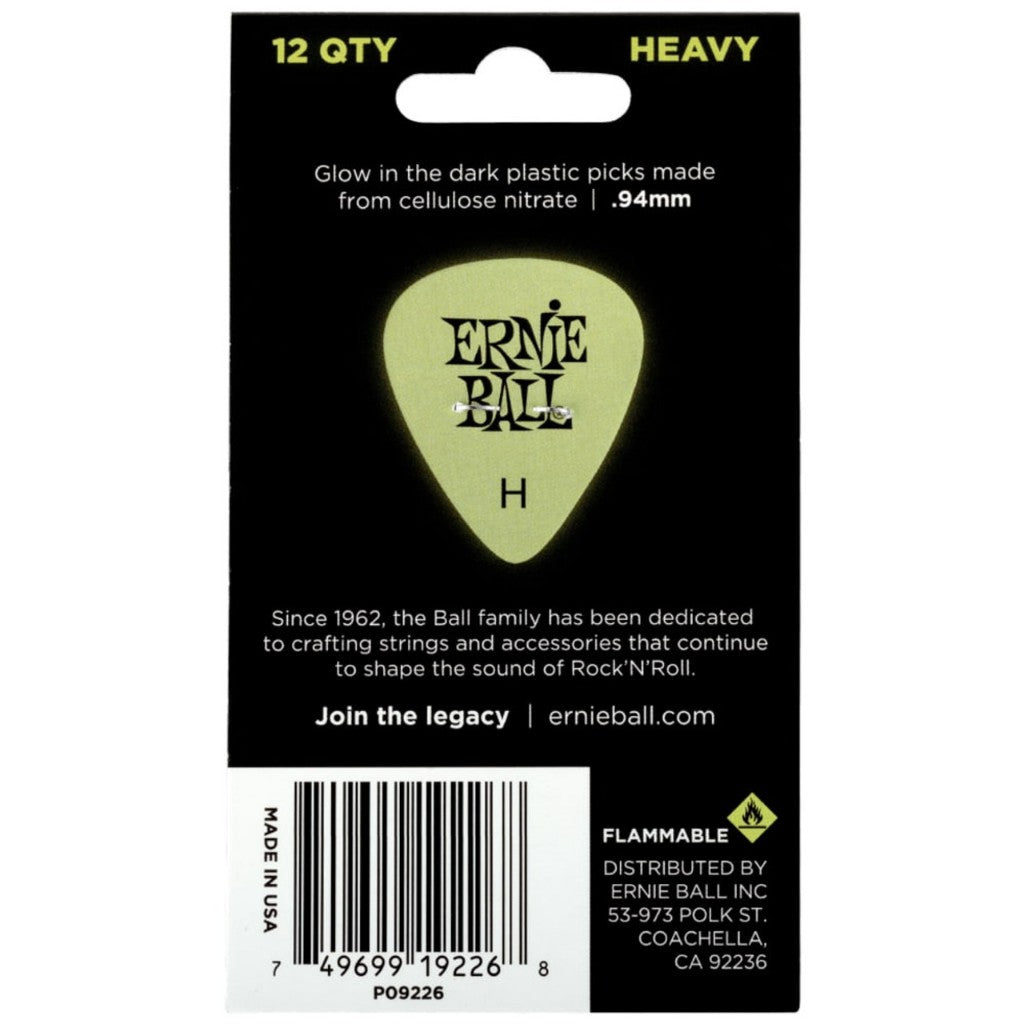 Ernie Ball heavy glow-in-the-dark plastic guitar picks in a 12-pack, shown on their black retail backing card.