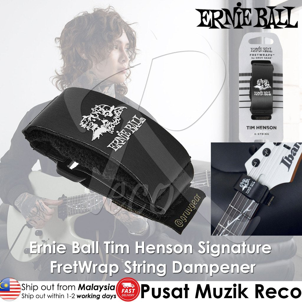 Ernie Ball Tim Henson Signature fretwrap string dampener in black with a white skull and crossbones logo, shown alongside its retail packaging and a guitar in the background.