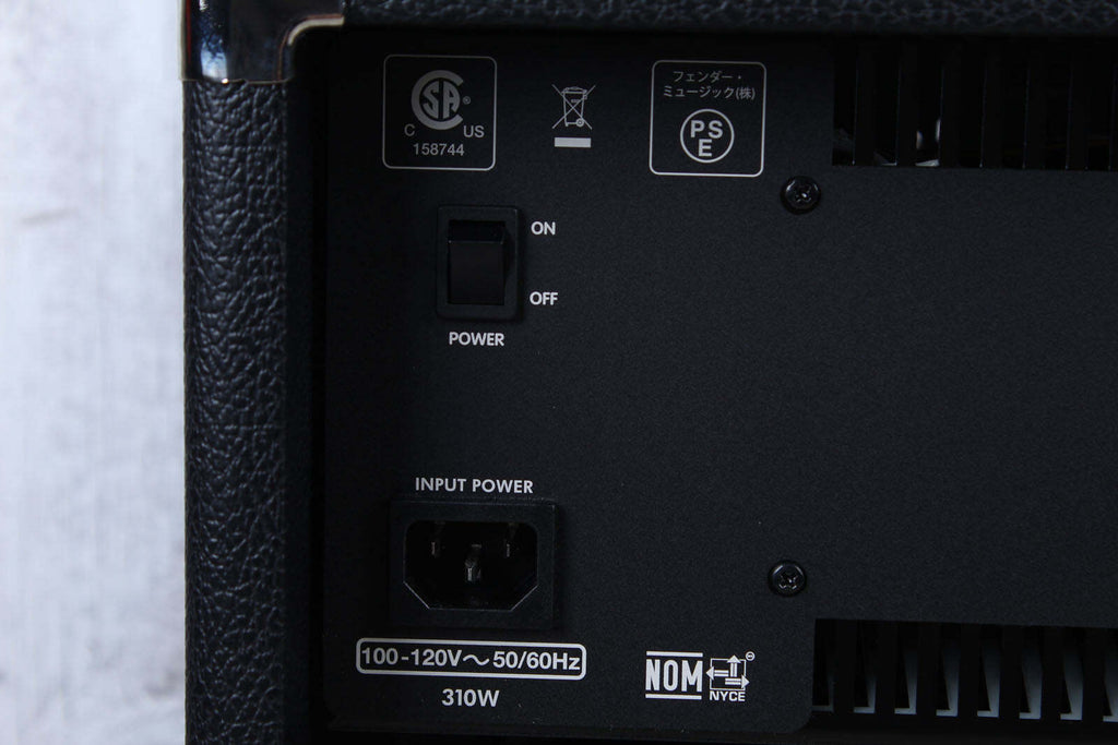 Back panel of a black electronic device with power switch and input/output ports.