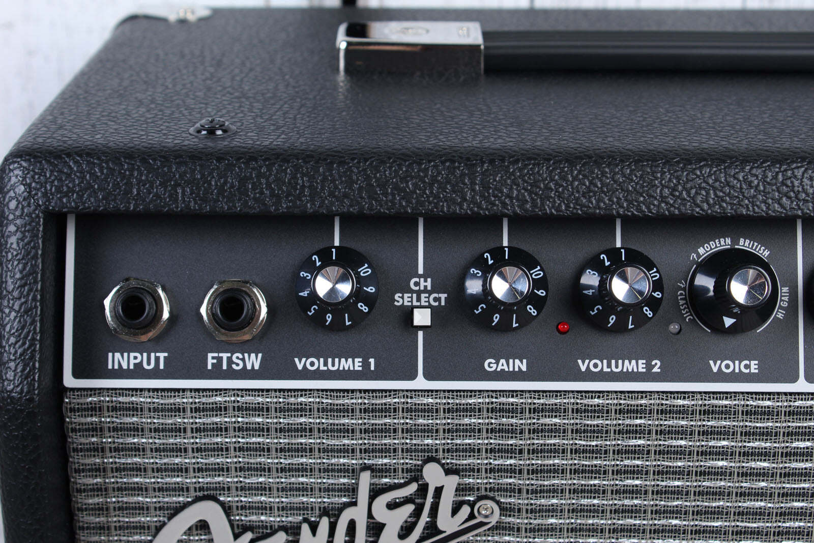 Fender guitar amplifier with control knobs and branding