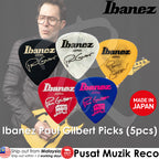 Ibanez guitar picks with a man holding a guitar, featuring the Ibanez brand.