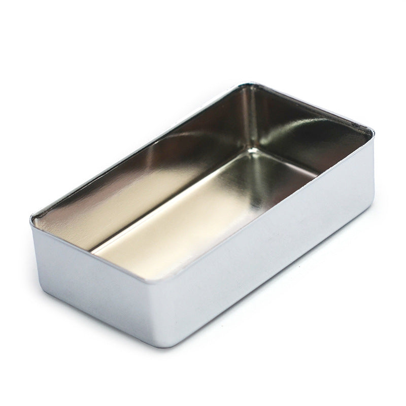 A rectangular stainless steel loaf pan with a polished metallic finish, shown from an elevated angle on a white background.