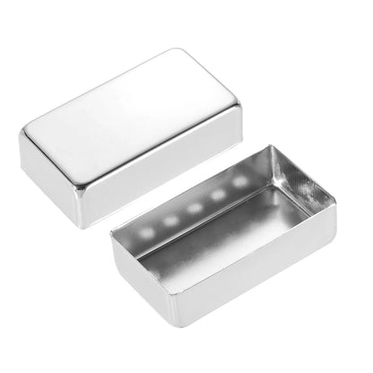 Two rectangular silver metal blocks, one closed and one open, shown on a plain white background.