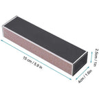 A rectangular sharpening stone or file with a dark gray top surface and a textured brown abrasive side, shown with teal dimension lines and labels indicating 15 cm length, 4 cm width, and 2.5 cm depth.