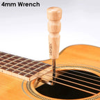 A wooden 4mm wrench with a natural wood handle and metal shaft, shown inserted into the sound hole of an acoustic guitar. The brand name 'XAVEX' is engraved on the handle.