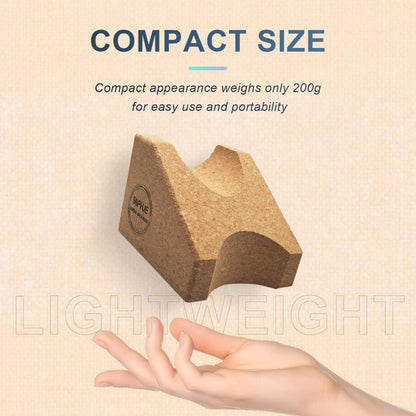 A cork sleep support wedge shown floating against a light beige textured background, with text reading 'COMPACT SIZE' and a hand below for scale. The product appears to be a compact brown cork support block with a curved cutout.