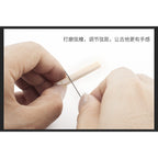 Close-up of a person's hands using a fine metal rod to smooth and adjust a light wood guitar string bed, with Chinese text at the top explaining string bed dressing and tension adjustment.