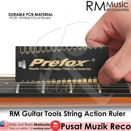 A hand holding a black RM Guitar Tools String Action Ruler with white text, against the background of a guitar fretboard.