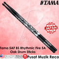 Tama drum sticks with 'Made in Japan' stamp on a pink background