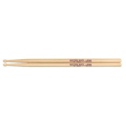 Two light natural wood drumsticks laid horizontally on a plain white background, with red printed text reading 'RHYTHM MAZE' and 'ATOM' on the shafts.