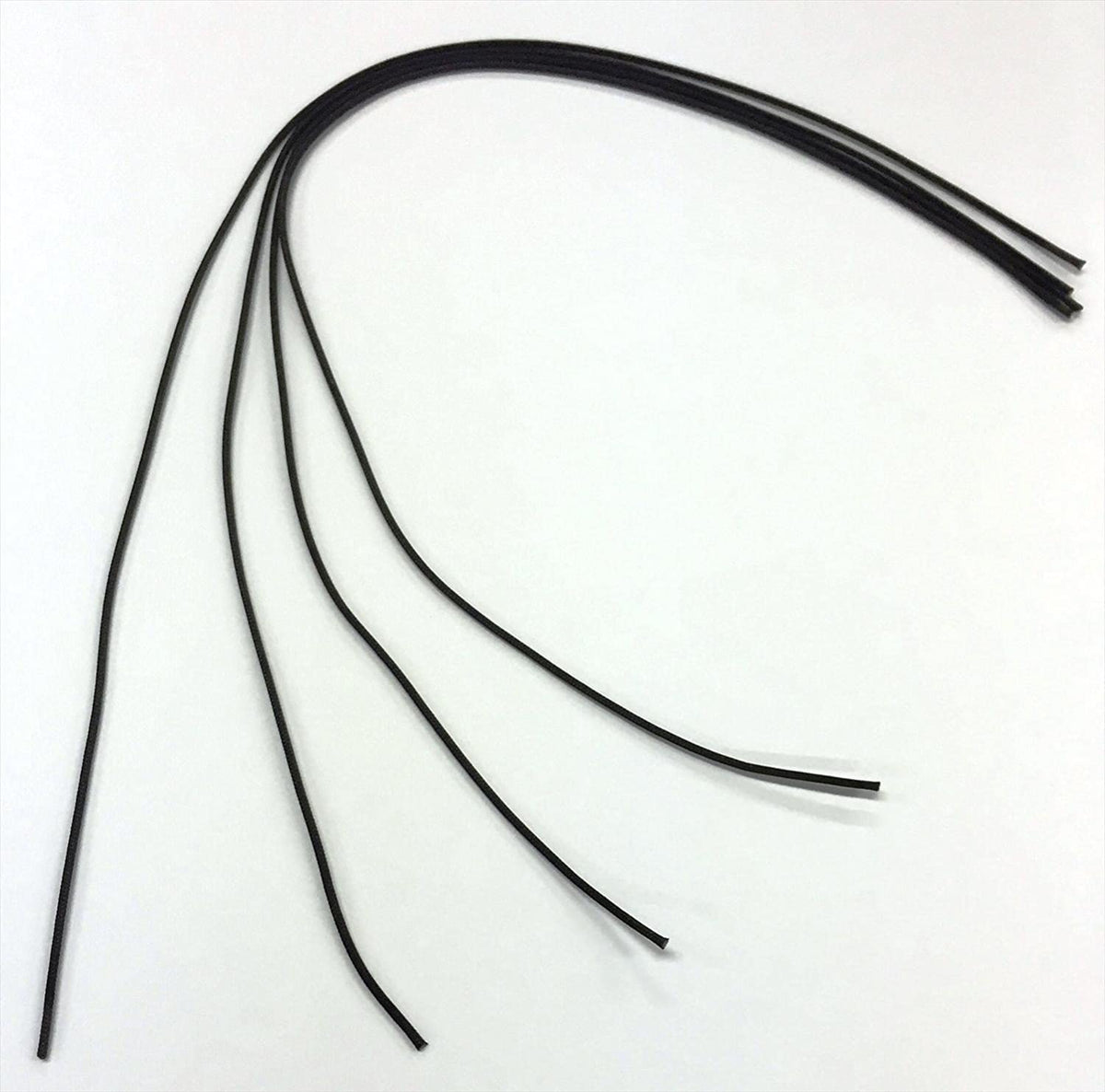 Set of black rubber strips on a white background