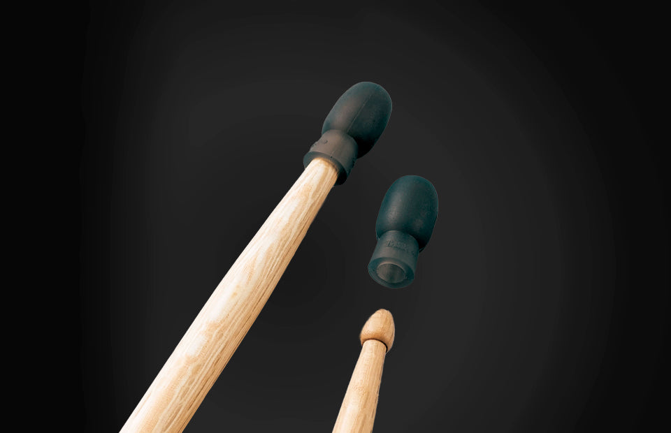 Two drumsticks with black rubber ends on a dark background